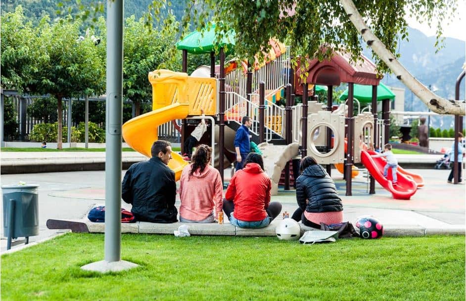 People playing at a playground, an activity that is free.
