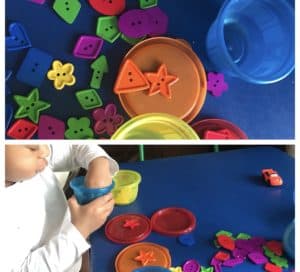 A child sorting buttons by color and shape.