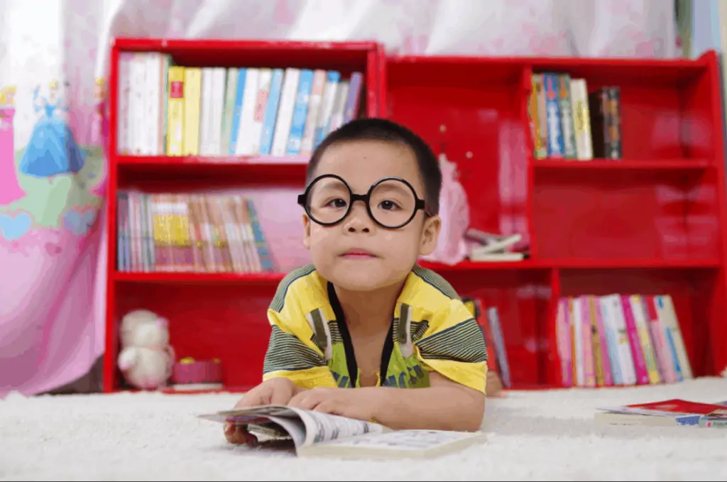 kid looking at a magazine looking for ways kids can make money