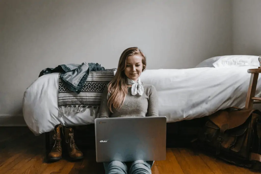 Woman on her laptop looking for a online job from home without investment. 