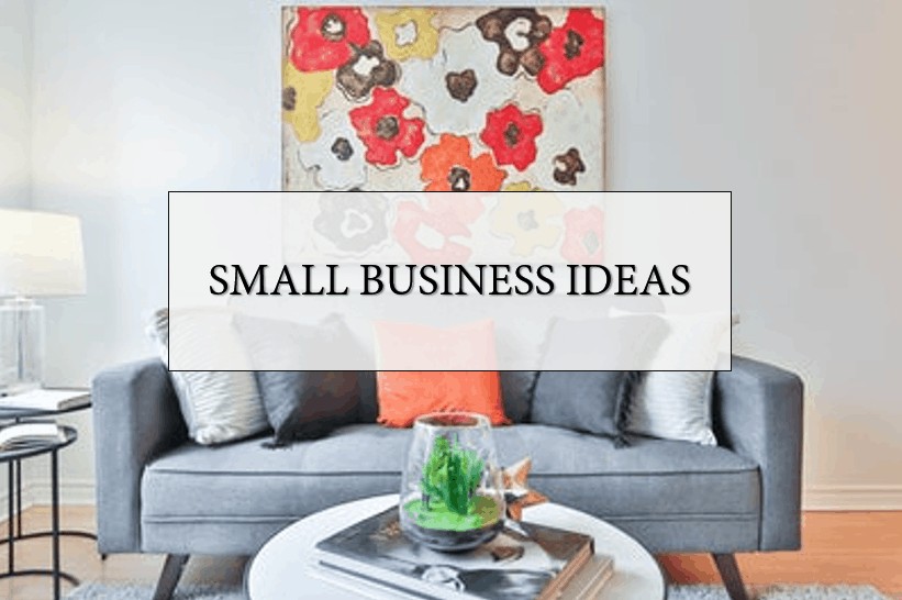 Creative Small Business Ideas sign in front of a blue couch with pillows and a picture of flowers on the wall.