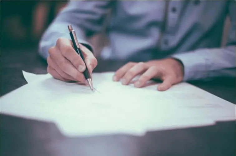 A man signing a loan