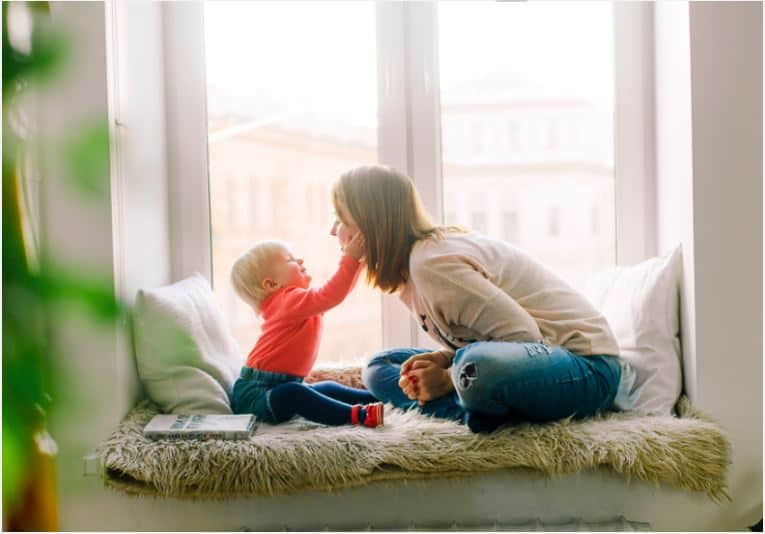 woman with a child working as a babysitter 