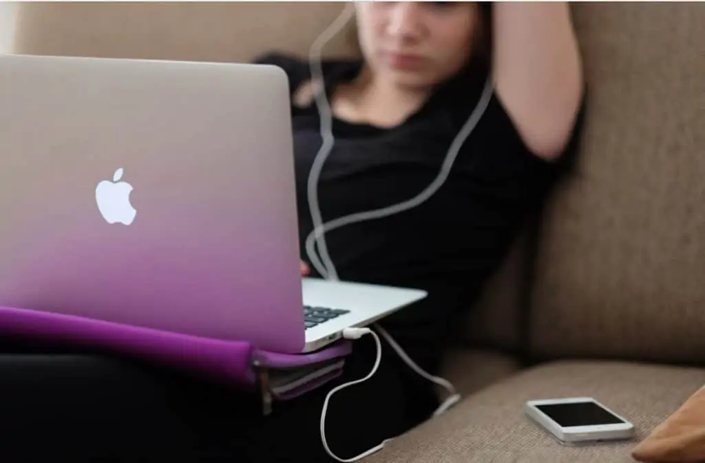 woman taking surveys on her laptop