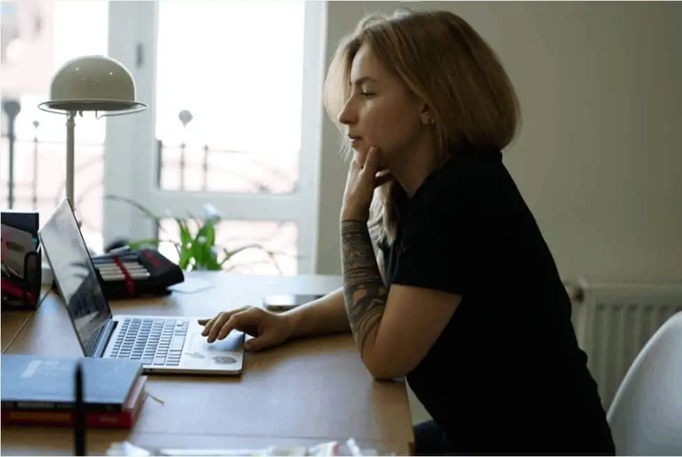 A woman working with Upvoice on her laptop