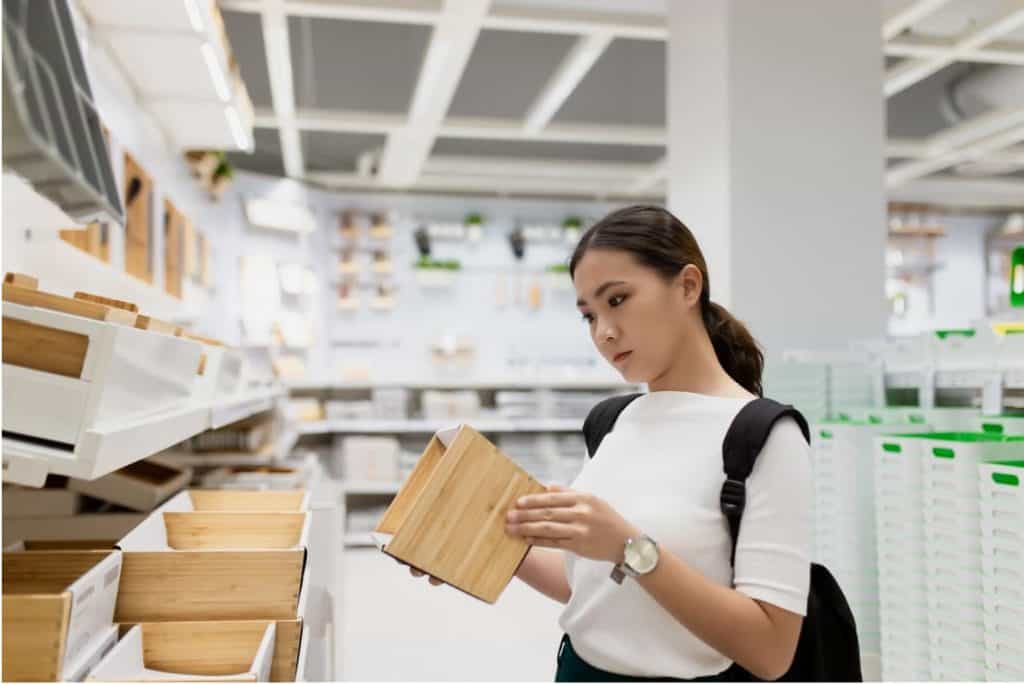 woman looking for products to sell on Amazon 