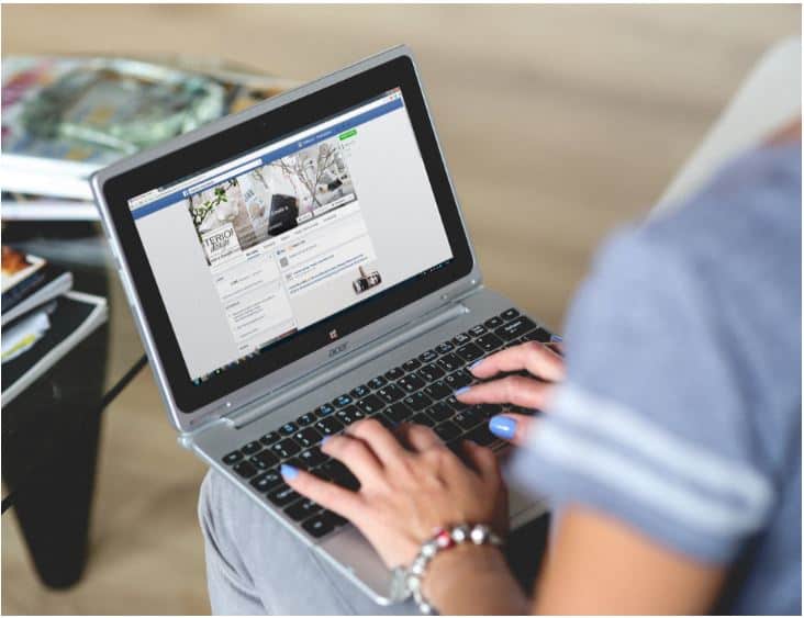 woman on a laptop working as a social media manager 