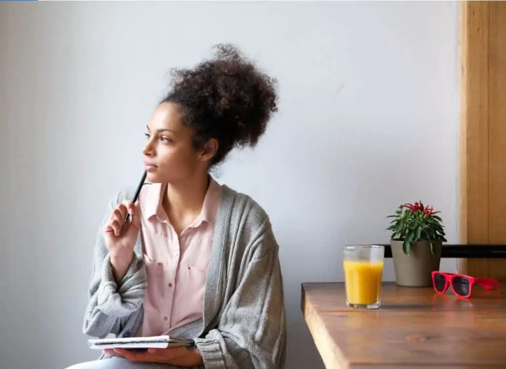 woman thinking about what to write for freelance writing