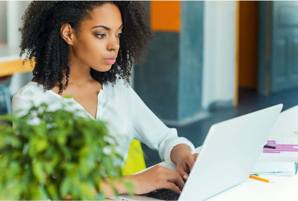 woman on her laptop working as a transcriber 