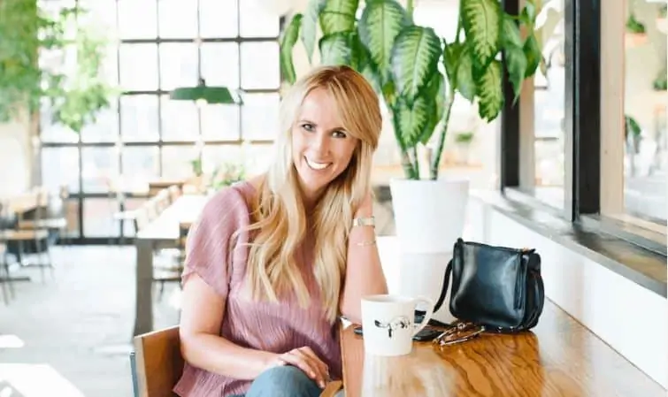 woman sitting at a desk working as a life coach 