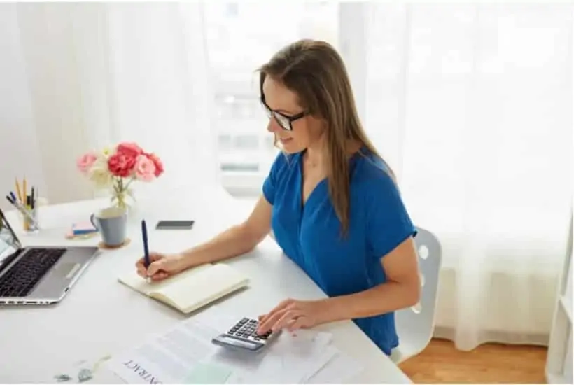 woman at a desk working as a bookkeeper from home 