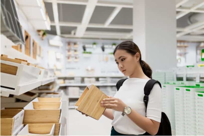 woman at the store looking for items to resell online 