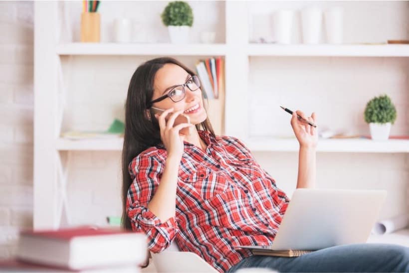 woman on her phone working as a customer service representative 