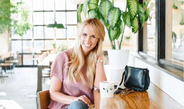 woman sitting at a desk working as a life coach 