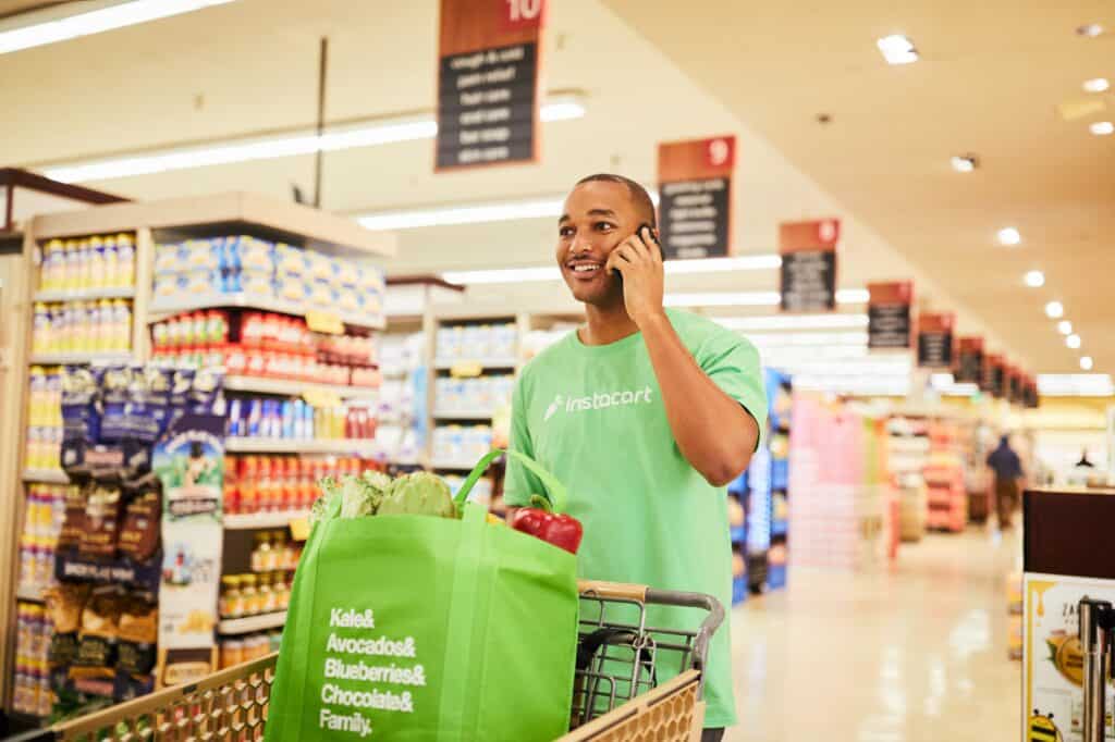 A man grocery shopping for Instacart.