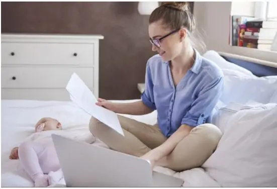 A woman working from home on her laptop