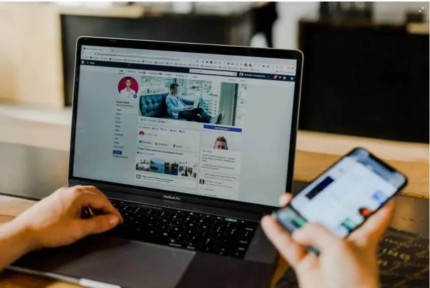 A laptop and phone that someone is using to work from home