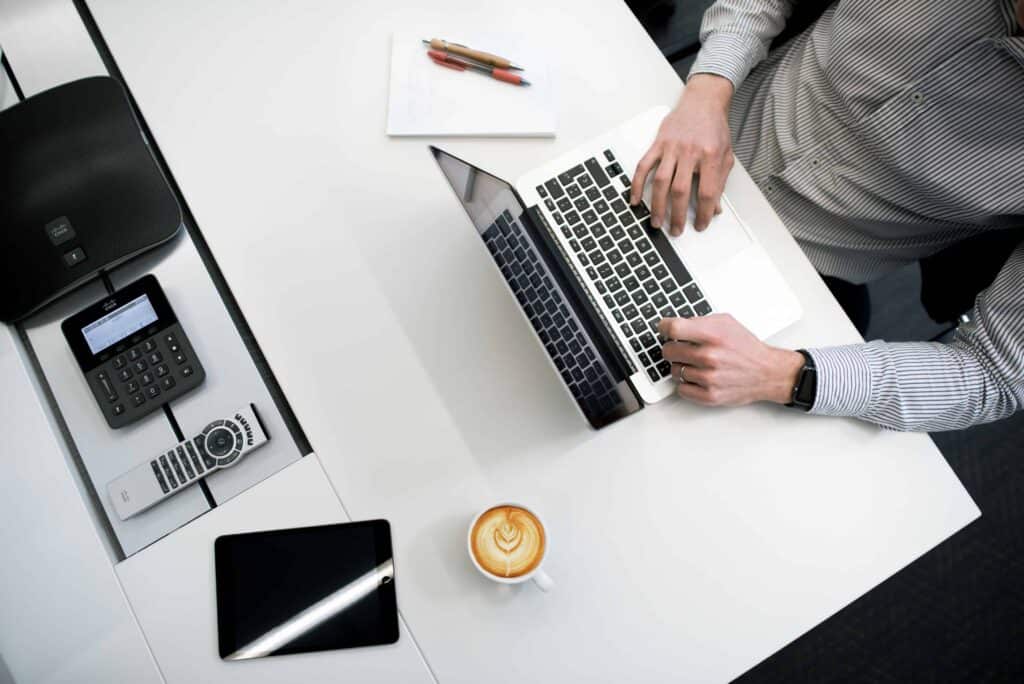 A man working on his laptop in an office