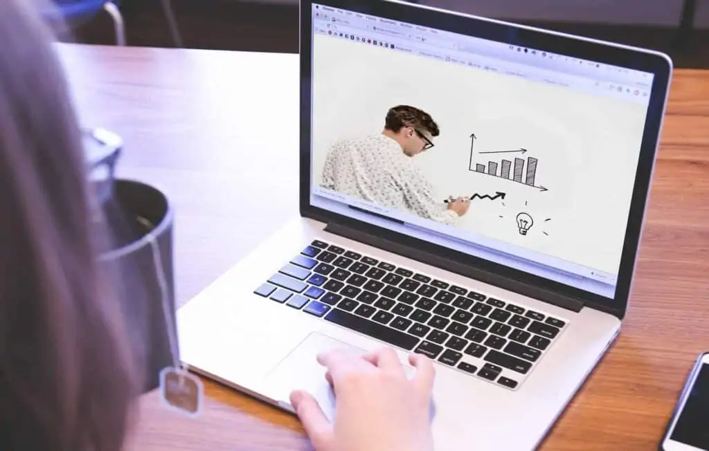 A man taking an online course on his laptop