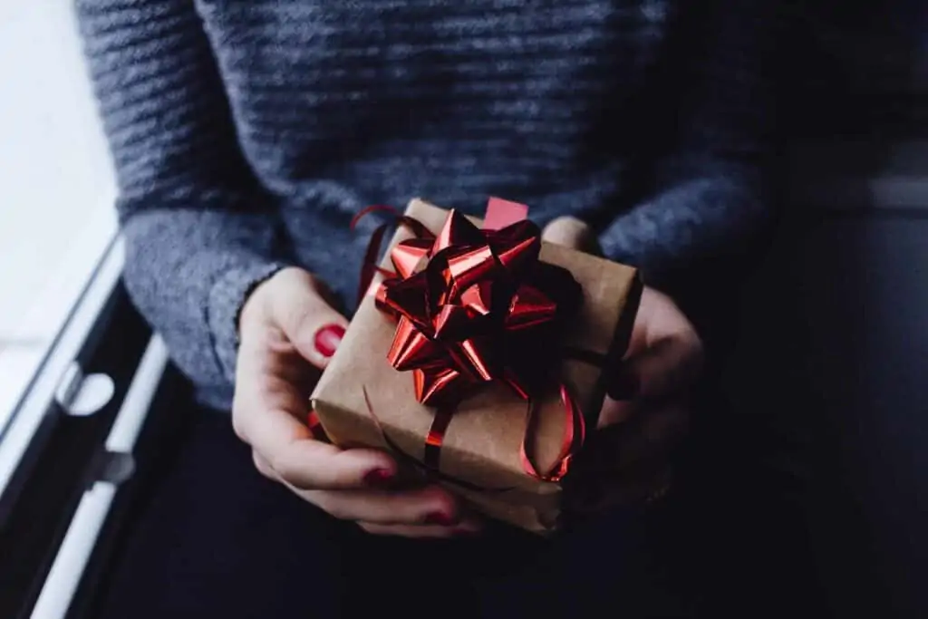 woman holding a wrapped gift