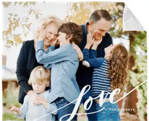 Photo blanket with a picture of a family on it