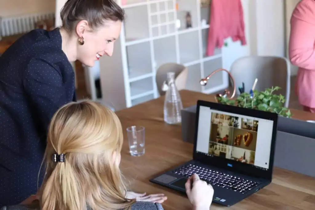 women looking at computer for article on list of gifts for entrepreneurs