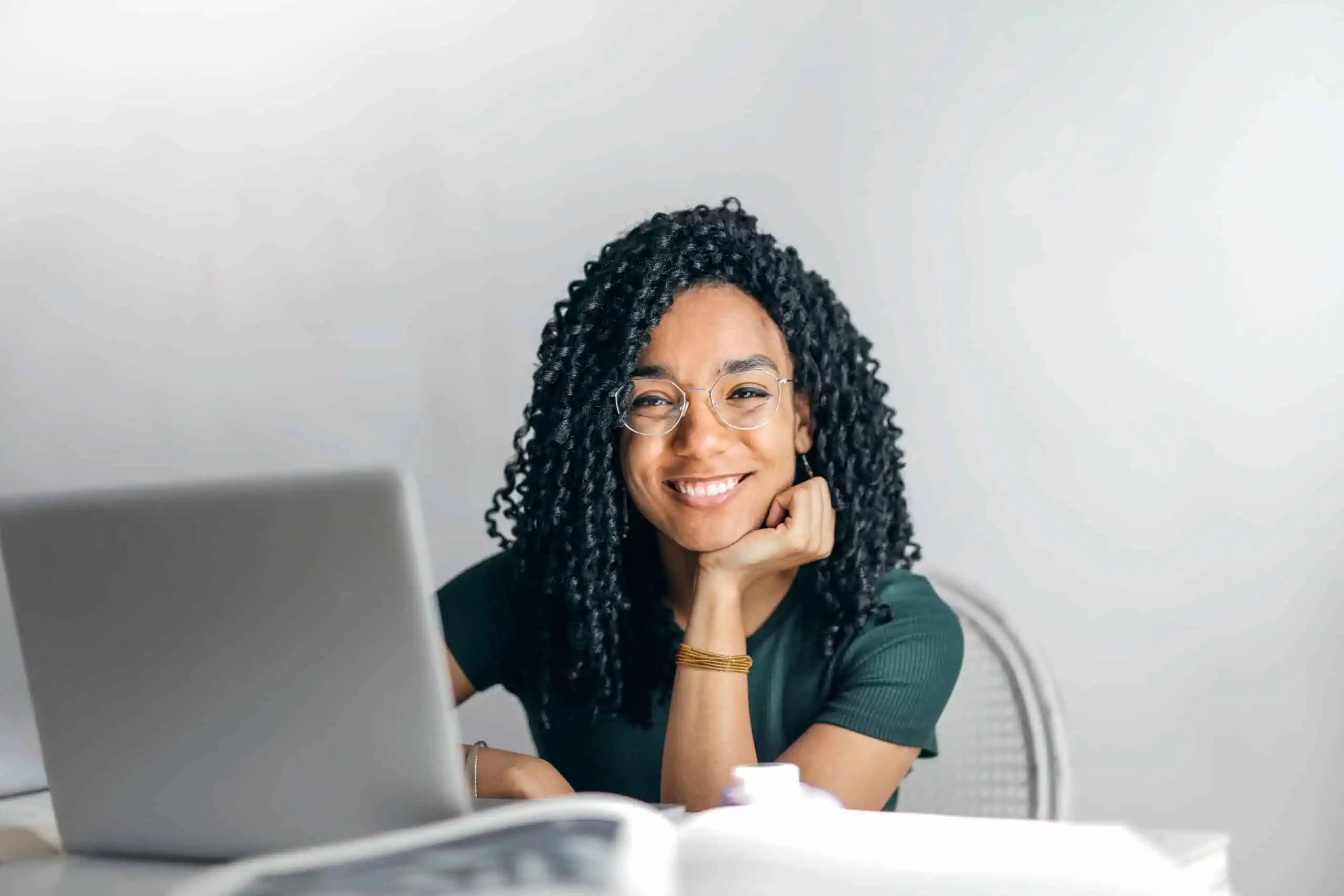 Girl working on a laptop smiling