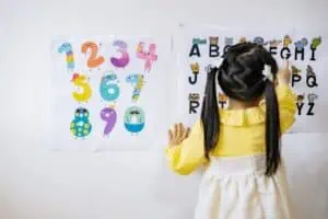 A little girl working on her alphabet
