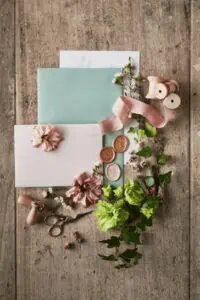Supplies to make invitations, flowers, cardstock, ribbon 