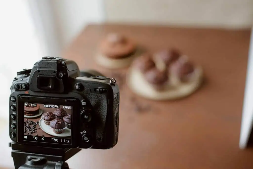 Camera taking a photo of chocolate muffins